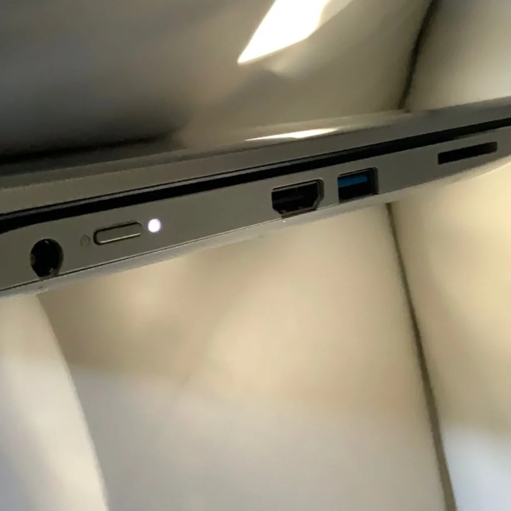 Toshiba Satellite Radius 11 L15W-B1208 with aftermarket charger. Touch screen.